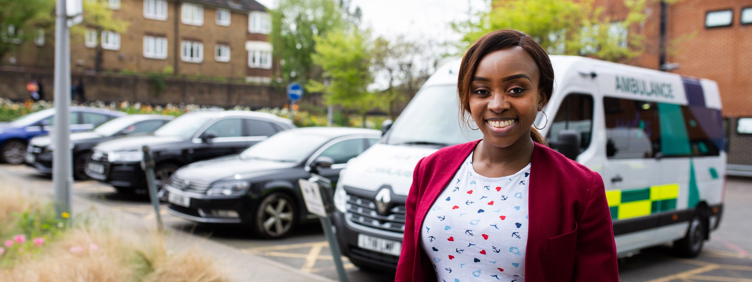 Woman standing by ambulances